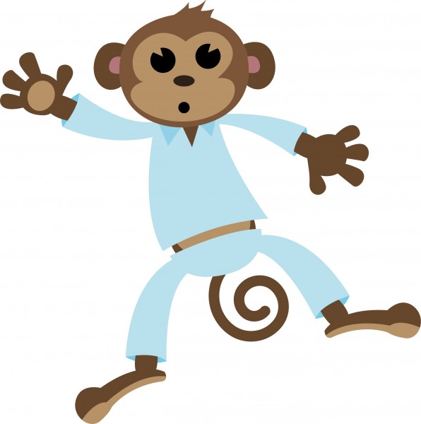 Monkey in pyjamas jumping on bed